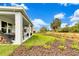 Spacious backyard with covered patio, green lawn, and tasteful landscaping offering a relaxing outdoor space at 5793 Timber Meadow Way, St Cloud, FL 34771