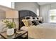 Bedroom showcasing a nightstand lamp, decorative plants, and books, enhancing a sophisticated style at 5793 Timber Meadow Way, St Cloud, FL 34771