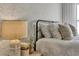 Charming bedroom features a decorative lamp and stylish wallpaper at 5793 Timber Meadow Way, St Cloud, FL 34771