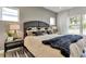 Comfortable bedroom featuring a modern bed with stylish pillows, a cozy blanket, and a neutral color scheme at 5793 Timber Meadow Way, St Cloud, FL 34771
