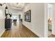 Bright hallway featuring wood floors, recessed lighting, and an inviting view into the living room at 5793 Timber Meadow Way, St Cloud, FL 34771