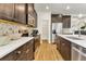 Well-equipped kitchen with stainless steel appliances, dark cabinetry, white countertops, and a convenient pantry at 5793 Timber Meadow Way, St Cloud, FL 34771