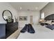 Beautifully staged bedroom with a black dresser, artwork, and a view into the walk-in closet at 5793 Timber Meadow Way, St Cloud, FL 34771