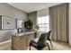 Well-lit home office featuring a wooden desk, modern decor, and neutral tones at 5793 Timber Meadow Way, St Cloud, FL 34771