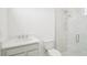 Modern bathroom with marble walls, glass-enclosed shower, and a stylish single-sink vanity at 2199 Broadbrook Drive, St Cloud, FL 34771