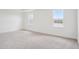 Bright bedroom features neutral carpeting, white walls and two windows with scenic views at 2199 Broadbrook Drive, St Cloud, FL 34771