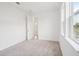 Bright bedroom featuring neutral carpet and a view to the outside through two large windows at 2199 Broadbrook Drive, St Cloud, FL 34771