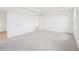 Bright bedroom features neutral carpeting and white walls, with doorways visible at 2199 Broadbrook Drive, St Cloud, FL 34771