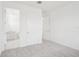Bright bedroom with a door leading to a full bathroom featuring modern fixtures and finishes at 2199 Broadbrook Drive, St Cloud, FL 34771
