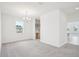 Carpeted dining room with modern chandelier and natural light at 2199 Broadbrook Drive, St Cloud, FL 34771