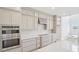 Modern kitchen with stainless steel appliances, stylish cabinets, and a center island at 2199 Broadbrook Drive, St Cloud, FL 34771