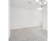 Carpeted living room with modern light fixture and natural light at 2199 Broadbrook Drive, St Cloud, FL 34771