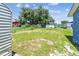 This home's backyard has a chain link fence, a grassy lawn, and lush mature landscaping at 2902 Wheeler St, Bartow, FL 33830