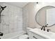 Bathroom featuring a white vanity and black hardware, along with a bathtub and tiled shower at 2902 Wheeler St, Bartow, FL 33830