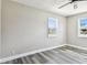Bright bedroom featuring modern ceiling fan, gray walls, and wood-look flooring at 2902 Wheeler St, Bartow, FL 33830