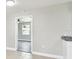Cozy room with a ceiling fan and an open doorway to a bedroom with wood-look laminate flooring at 2902 Wheeler St, Bartow, FL 33830