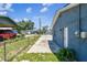 Side view of house and driveway with chain link fence at 2902 Wheeler St, Bartow, FL 33830