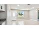 Spacious room with window and recessed lighting, featuring tile floors and an open doorway at 2902 Wheeler St, Bartow, FL 33830