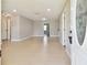 Bright living room featuring tile floors and a neutral color palette, offering a clean and inviting space at 2902 Wheeler St, Bartow, FL 33830