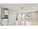 Bright living space with an open doorway and a window allowing natural light, complemented by tile flooring at 2902 Wheeler St, Bartow, FL 33830