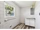 Room featuring concrete block walls, laminate floors, and a window with natural light at 2902 Wheeler St, Bartow, FL 33830