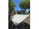 Large backyard featuring a concrete patio, mature trees, and ample space for outdoor entertaining and relaxation at 3802 Bryston Dr, Orlando, FL 32822