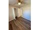 Bedroom with vinyl floors, ceiling fan and closet with shelving system at 3802 Bryston Dr, Orlando, FL 32822