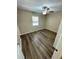 Bedroom showcasing vinyl plank flooring, neutral walls, and ceiling fan at 3802 Bryston Dr, Orlando, FL 32822