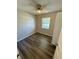 This bedroom features modern flooring, neutral walls, and a ceiling fan at 3802 Bryston Dr, Orlando, FL 32822