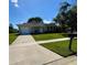 Charming single-story home featuring a well-manicured lawn and attached garage at 3802 Bryston Dr, Orlando, FL 32822