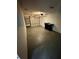 Spacious garage features overhead door, painted floor, and wall shelving for organized storage solutions at 3802 Bryston Dr, Orlando, FL 32822