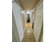 Hallway featuring neutral walls and tile floors connects the various rooms in the house at 3802 Bryston Dr, Orlando, FL 32822