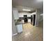 Updated kitchen with stainless steel appliances and bright white cabinetry at 3802 Bryston Dr, Orlando, FL 32822