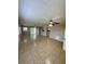 Large living area featuring tile floors, ceiling fans, and access to the outdoors at 3802 Bryston Dr, Orlando, FL 32822