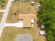 Aerial view showcasing the home's layout, driveway, and surrounding yard space at 21078 Sw Honeysuckle St, Dunnellon, FL 34431