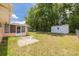 Large backyard featuring a shed and patio area, ideal for outdoor activities and storage at 21078 Sw Honeysuckle St, Dunnellon, FL 34431