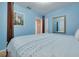Bedroom with light blue walls features four poster bed and a view to the en suite at 21078 Sw Honeysuckle St, Dunnellon, FL 34431