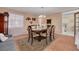 Dining room featuring a table and chairs, tile flooring, and access to other rooms at 21078 Sw Honeysuckle St, Dunnellon, FL 34431