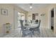 Bright dining room features a table with seating for four and sliding doors to outdoor space at 21078 Sw Honeysuckle St, Dunnellon, FL 34431