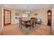 Elegant dining room with formal table and chairs, chandelier, and classic tile flooring at 21078 Sw Honeysuckle St, Dunnellon, FL 34431