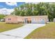 Charming single-story home features an attached two-car garage and long driveway with ample parking at 21078 Sw Honeysuckle St, Dunnellon, FL 34431