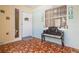 Inviting foyer with vintage tile, decor, and window seat offers a welcoming entrance to the home at 21078 Sw Honeysuckle St, Dunnellon, FL 34431
