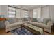 Comfortable living room with ample seating, a large rug, and bright natural light at 21078 Sw Honeysuckle St, Dunnellon, FL 34431