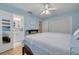 Bedroom with en-suite bathroom has calming blue walls and a fireplace accent at 21078 Sw Honeysuckle St, Dunnellon, FL 34431