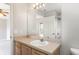 Bathroom with a vanity, large mirror, and doorway to the bedroom at 3235 Grand Pines Dr, Lakeland, FL 33810