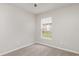 Neutral bedroom with plush carpeting and a window with a view at 3235 Grand Pines Dr, Lakeland, FL 33810