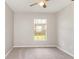 Neutral bedroom with plush carpeting, a ceiling fan, and a window with a view at 3235 Grand Pines Dr, Lakeland, FL 33810