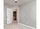 Neutral bedroom with plush carpeting, and doorway to attached bathroom at 3235 Grand Pines Dr, Lakeland, FL 33810