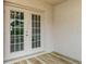 Relaxing Florida room with tile floors, screen windows with backyard views, and ceiling fan at 3235 Grand Pines Dr, Lakeland, FL 33810