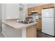Kitchen area with stainless steel sink, and wood-look flooring at 3235 Grand Pines Dr, Lakeland, FL 33810